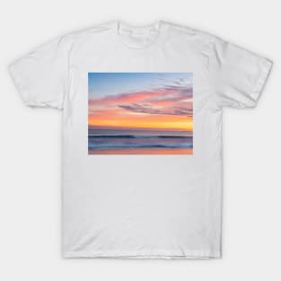 Brilliant summer sunrise along  beach with sea view and sweeping colorful cloud formations T-Shirt